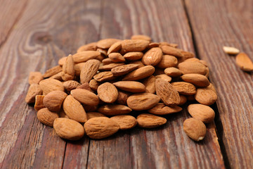 almond on wood background