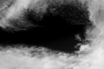 Clouds over black.