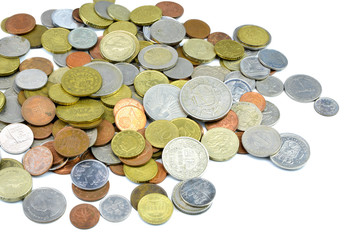 Silver and copper coins from around the world on isolated background