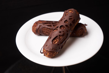 Decorated Chocolate eclairs with chocolate