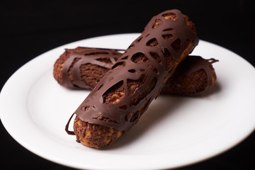 Decorated Chocolate eclairs with chocolate