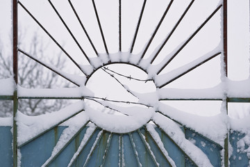 bad weather/ decline of poverty and barbed wire on the fence during bad weather and snowfall