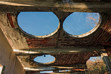 Holes in the ceiling of an old abandoned factory © serghi8