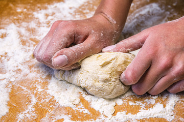 female hands and dough
