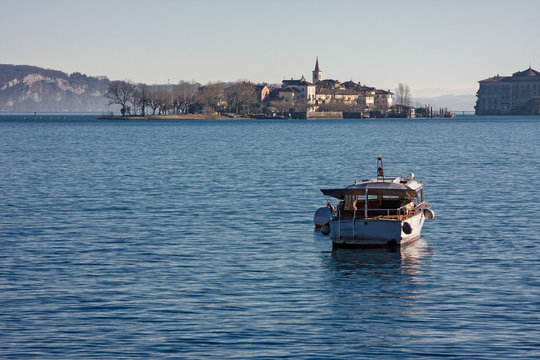 a motor boat is moored on the lake.