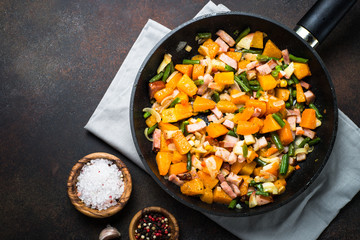 Pumpkin fried with vegetables and bacon. 