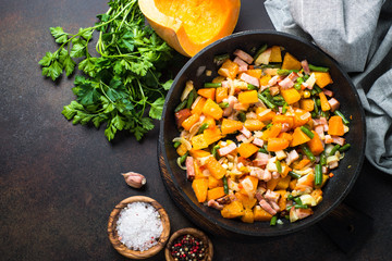 Pumpkin fried with vegetables and bacon. 