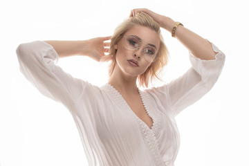 Naklejka premium Attractive blonde young lady all in white.