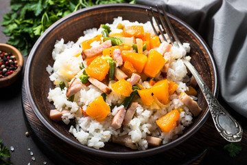 Risotto with pumpkin, vegetables and bacon.