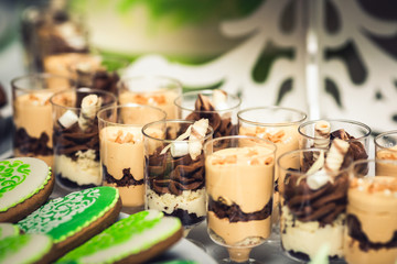  sweet cookies in the form of heart and chocolate mousse in a glass