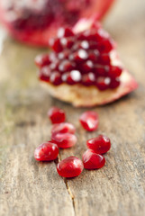 organic pomegranate fruit on a wood background