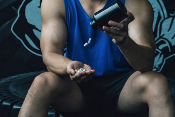Doping anabolic pills bodybuilder bodybuilding muscles fitness studio gym strong muscular man