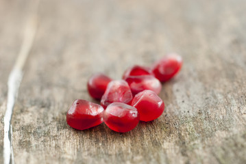 organic pomegranate fruit on a wood background