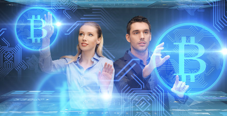 businessman and businesswoman with bitcoins