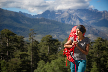 Fototapeta na wymiar Pretty, female hiker in high mountains 