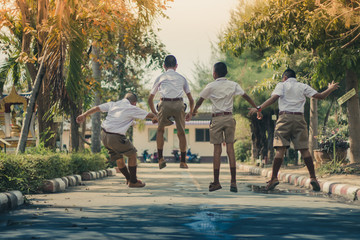 Fototapeta premium Group of Friends Having Fun on street in primary school.