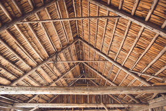 The roof of the old wooden barn from the interior