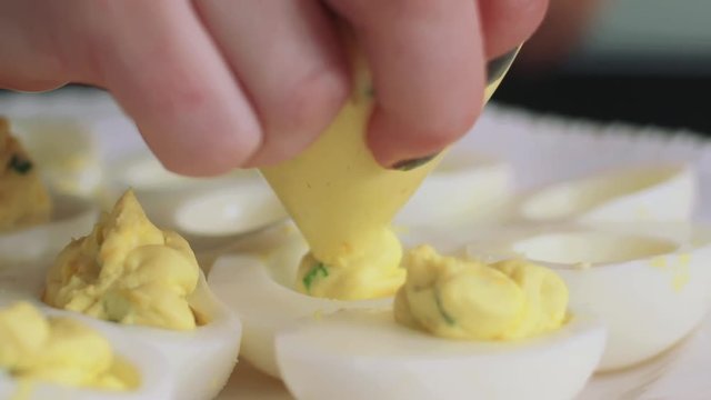 Piping deviled egg filling
