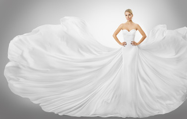 Fototapeta na wymiar Woman White Flying Dress, Elegant Fashion Model Posing in Wedding Fluttering Gown, Bride Art Beauty Portrait