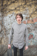 Obraz premium Young handsome caucasian man with moustache