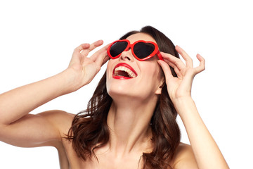 woman with red lipstick and heart shaped shades