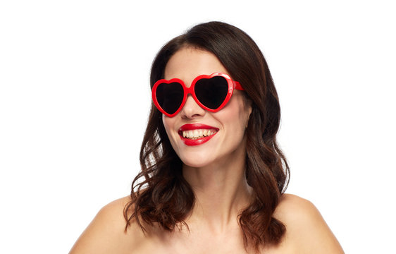 woman with red lipstick and heart shaped shades