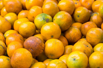 Healthy fruits, orange fruits background many orange fruits - orange fruit background