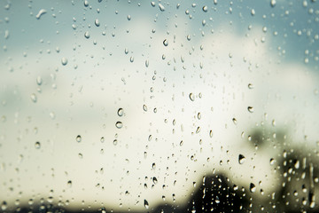 Rain drops on glass close up background.