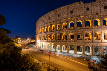 Fototapeta na wymiar Night view of Colosseum in Rome, Italy. Rome architecture and landmark. Rome Colosseum is one of the main attractions of Rome and Italy