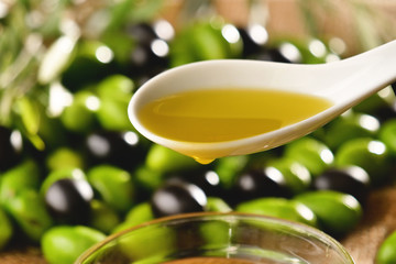 Genuine Italian olives organic oil cold pressed  falls. concept of nature and healthy food, healthy and natural. fresh olives and Tuscan Italian oil
