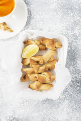 Homemade fresh cookies dusted powdered sugar in white plate