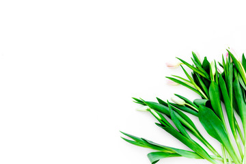Spring bouquet of delicate pink tulips on white background top view copy space