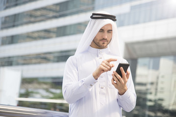 businessman arabic hand using mobile phone. concept communication. © NaMong Productions