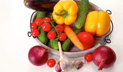 Fresh autumn vegetables on a white background