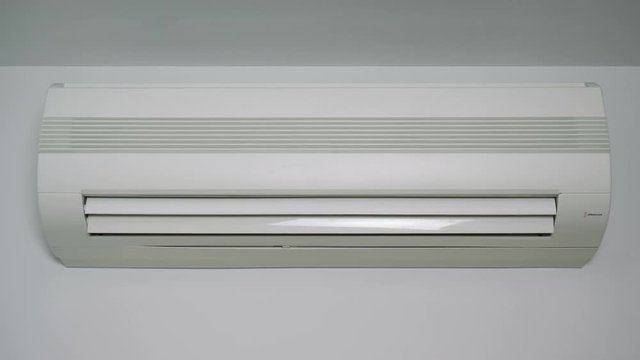 Front view at an operating air conditioner. (loop ready video)