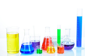 Laboratory glassware with colorful chemical reagent in research laboratory 
