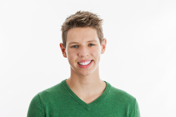 Happy Teenage Boy in Green Holiday Sweater