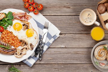 English breakfast. Fried eggs, sausages, bacon
