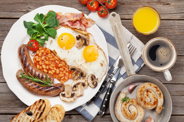 English breakfast. Fried eggs, sausages, bacon
