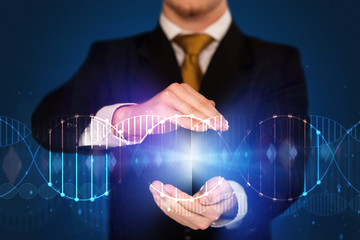 Businessman holding DNA