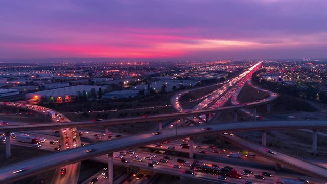 Aerial timelapse of heavy traffic on the freeway and highway with car lights