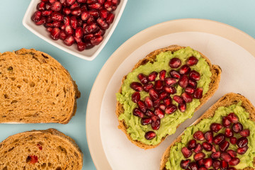 Avocado and Pomegranate Seeds Open Face Sandwich On Mediterranean Bread