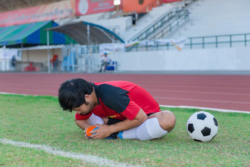 Portrait of asian soccer player warm up before big match in the field,Thailand people
