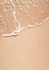 wave on sandy beach