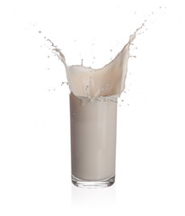 Milk splashing from glass isolated on a white background