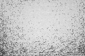 Gray colorless background of sequined fabric with glitter