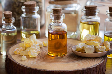 A bottle of frankincense essential oil with frankincense