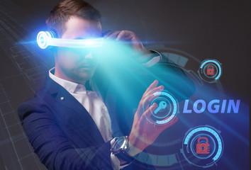 Business, Technology, Internet and network concept. Young businessman working on a virtual screen of the future and sees the inscription: Login