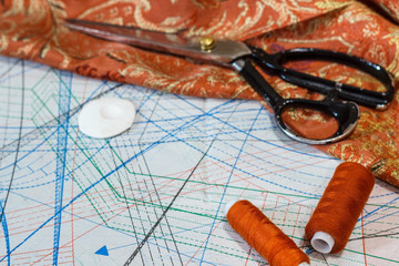 Still life of objects for sewing: threads, scissors, centimeter, pins.