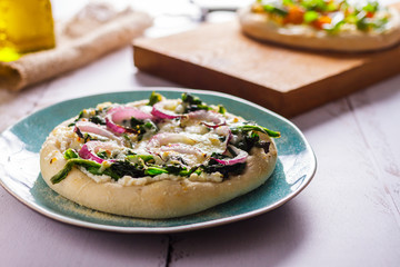 White pizza with spinach and onions. Italian Cuisine
